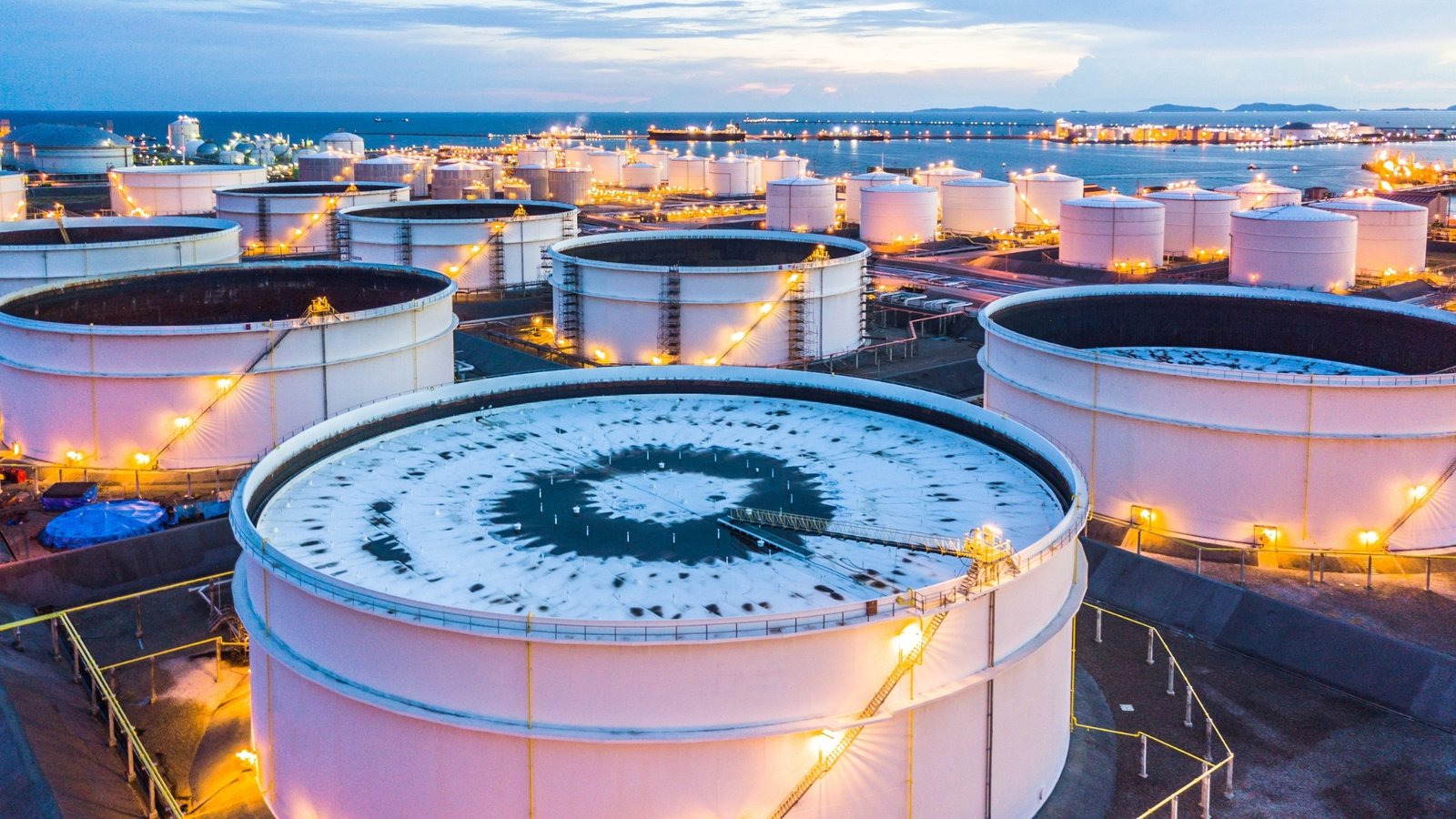 An aerial coastal gas storage and import terminal at dusk