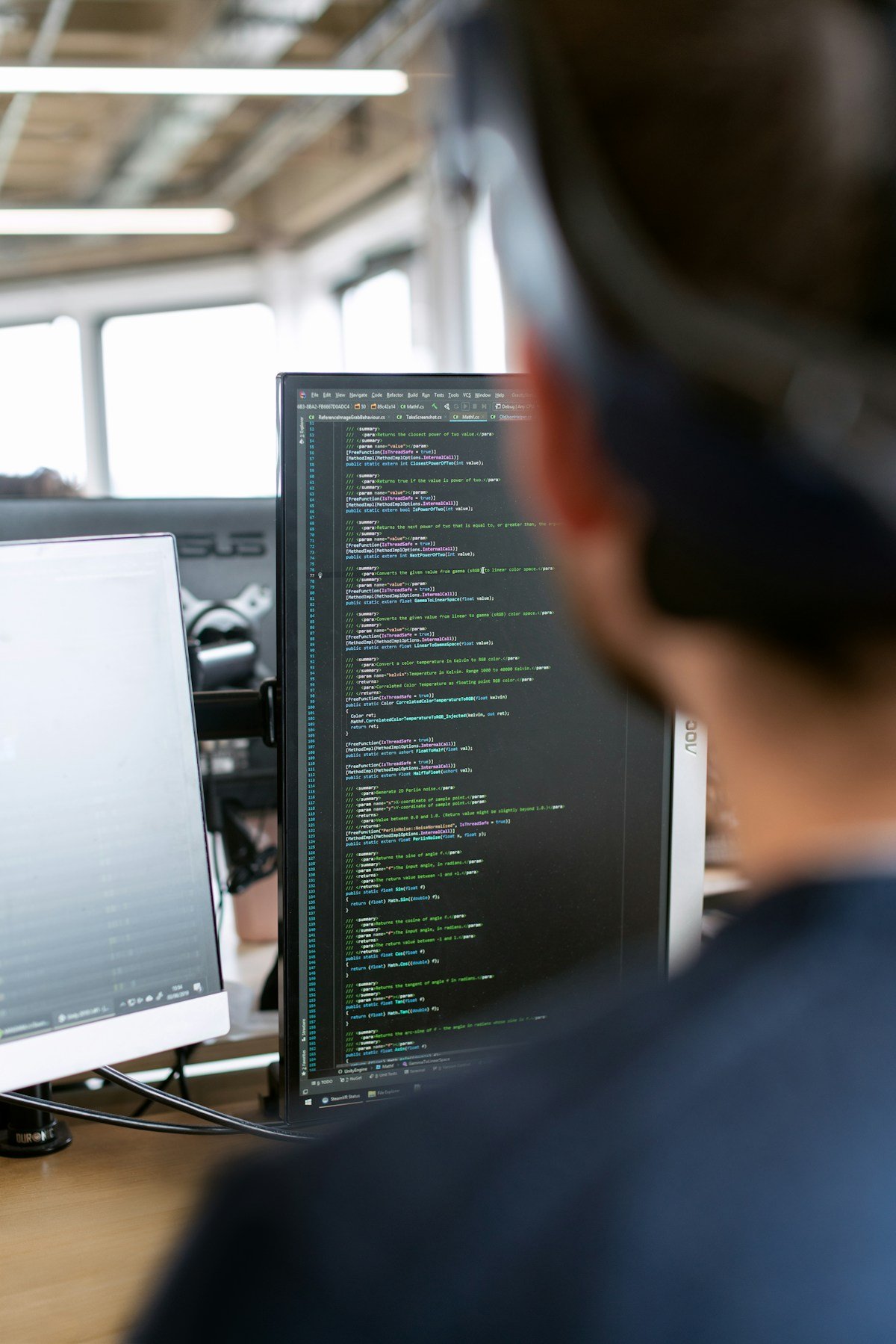 Enrichment is engineering: an operator working across code on dual monitors, the reality behind AI lead workflows