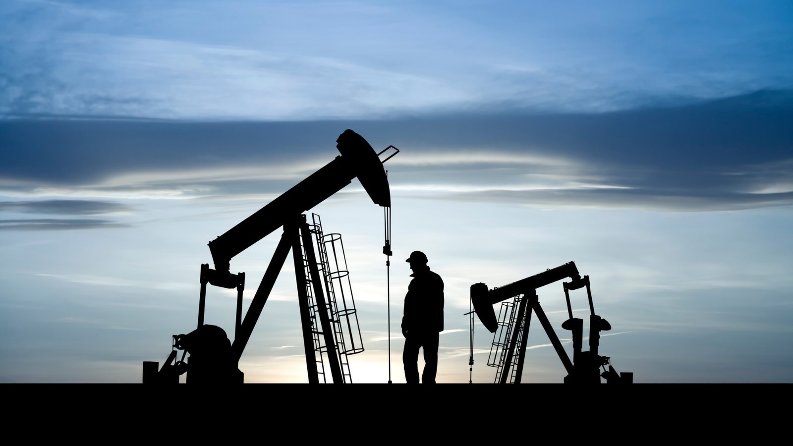 Pumpjacks at dusk, representing Occidental's low cost Permian oil.