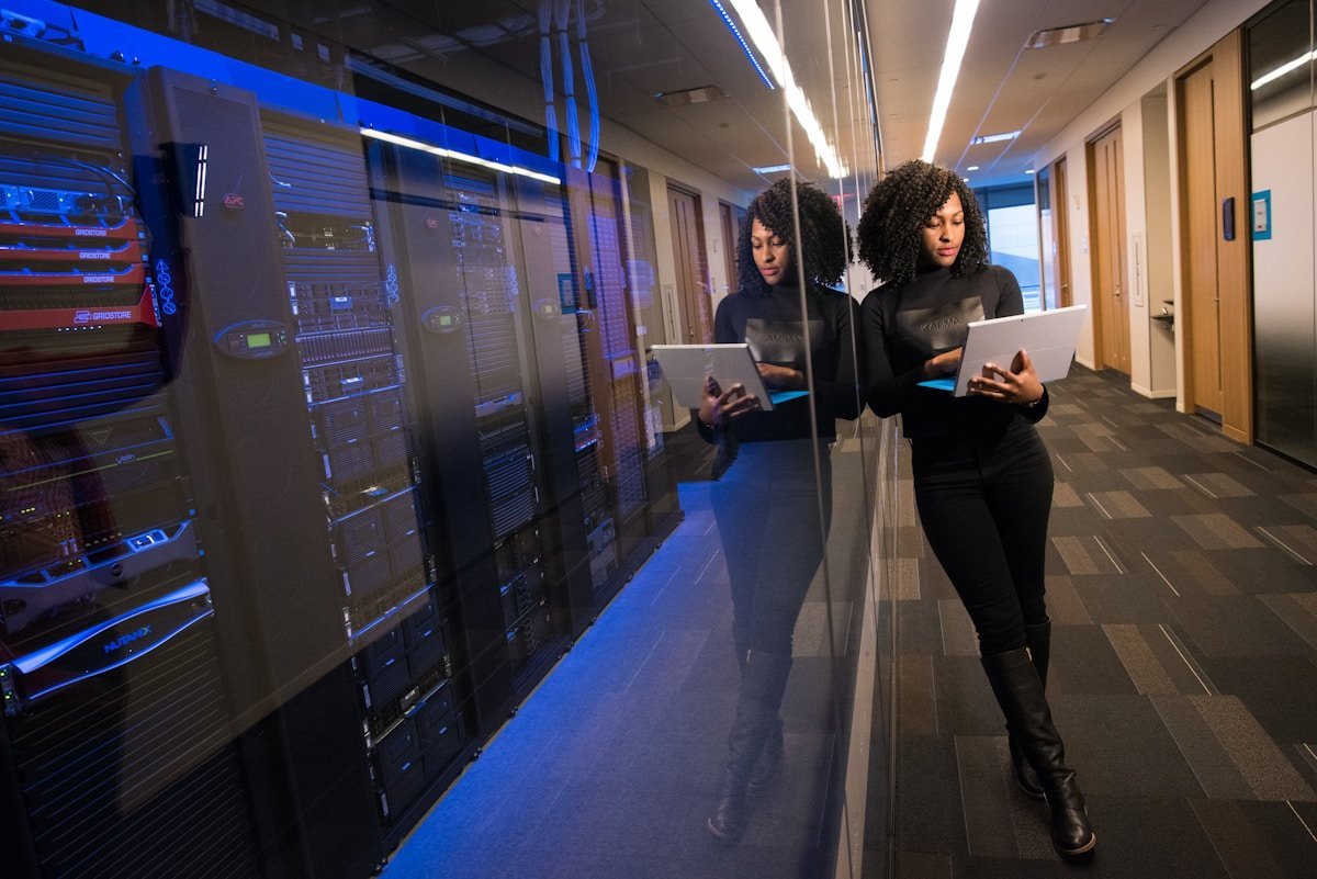 A data hall and its engineer. Whether this load connects as a customer, a neighbour or a generator's private offtake is the question six grid operators were ordered to answer.